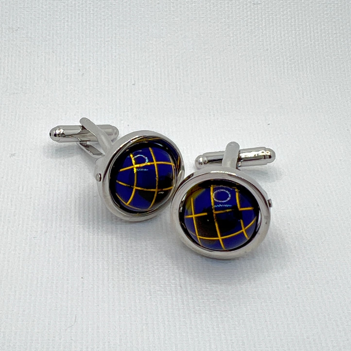 Tasker & Shaw | Luxury Menswear | Dark blue spinning globes