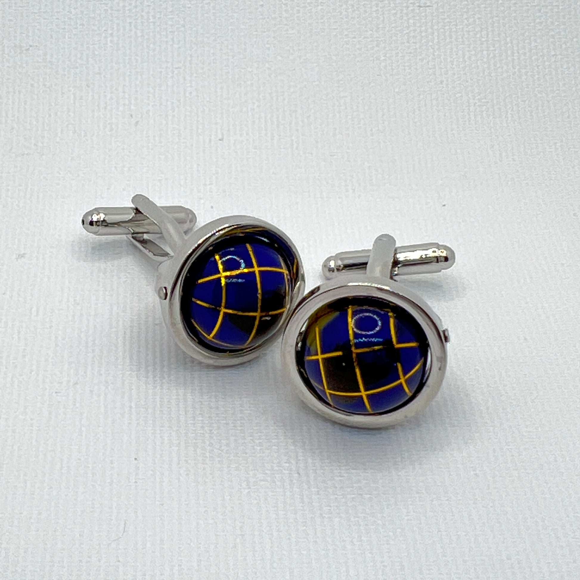 Tasker & Shaw | Luxury Menswear | Dark blue spinning globes