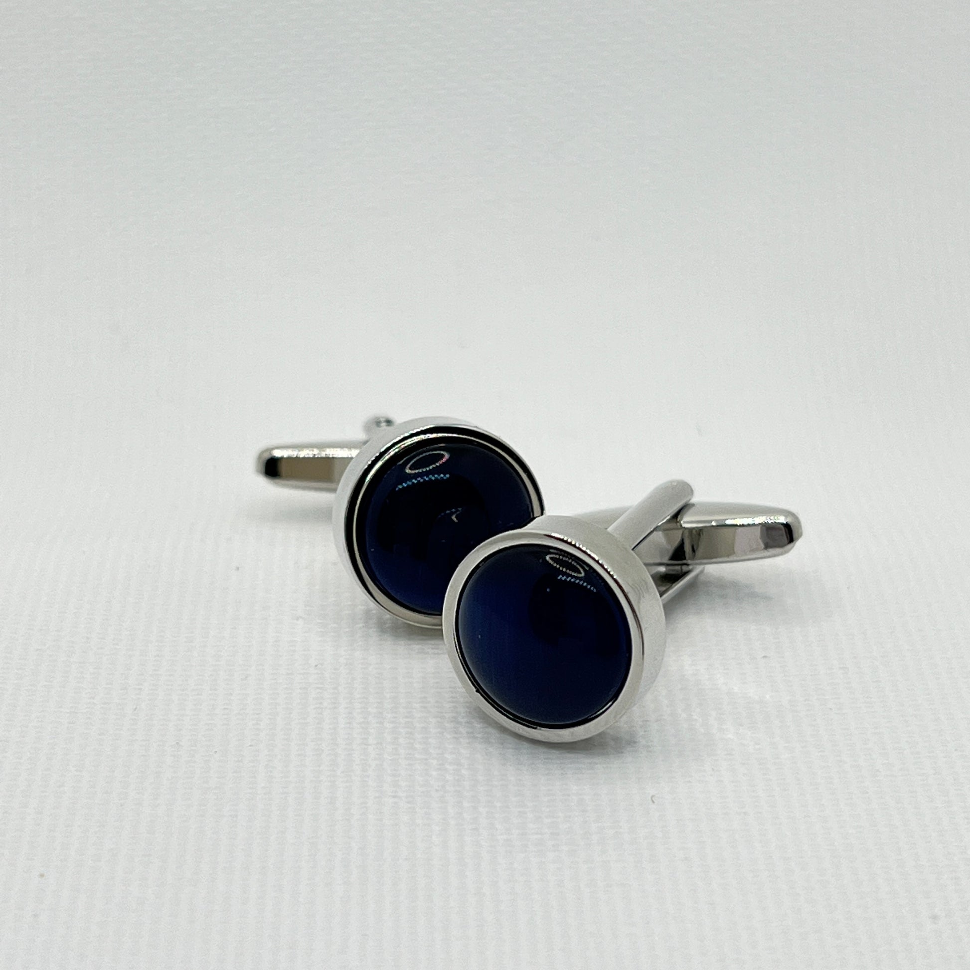 Tasker & Shaw | Luxury Menswear | Round silver cufflinks with deepest blue inlay