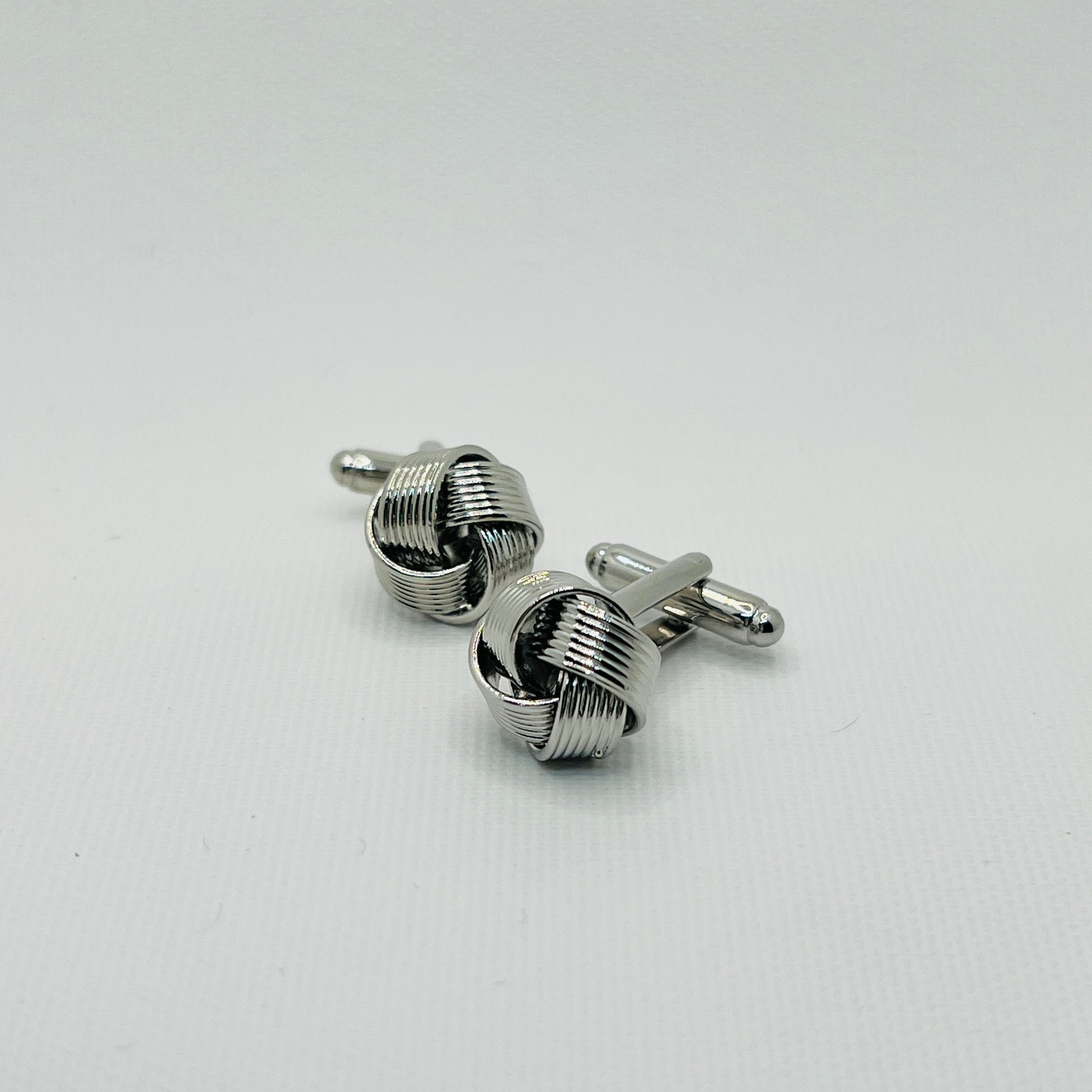 Tasker & Shaw | Luxury Menswear | Silver ribbon knot cufflinks