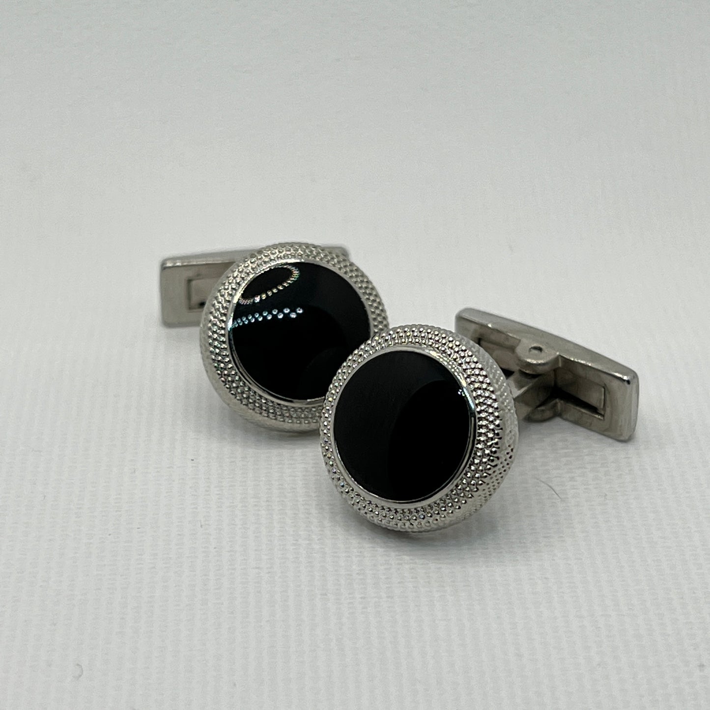 Tasker & Shaw | Luxury Menswear | Silver round cufflinks with machined and black inlay front