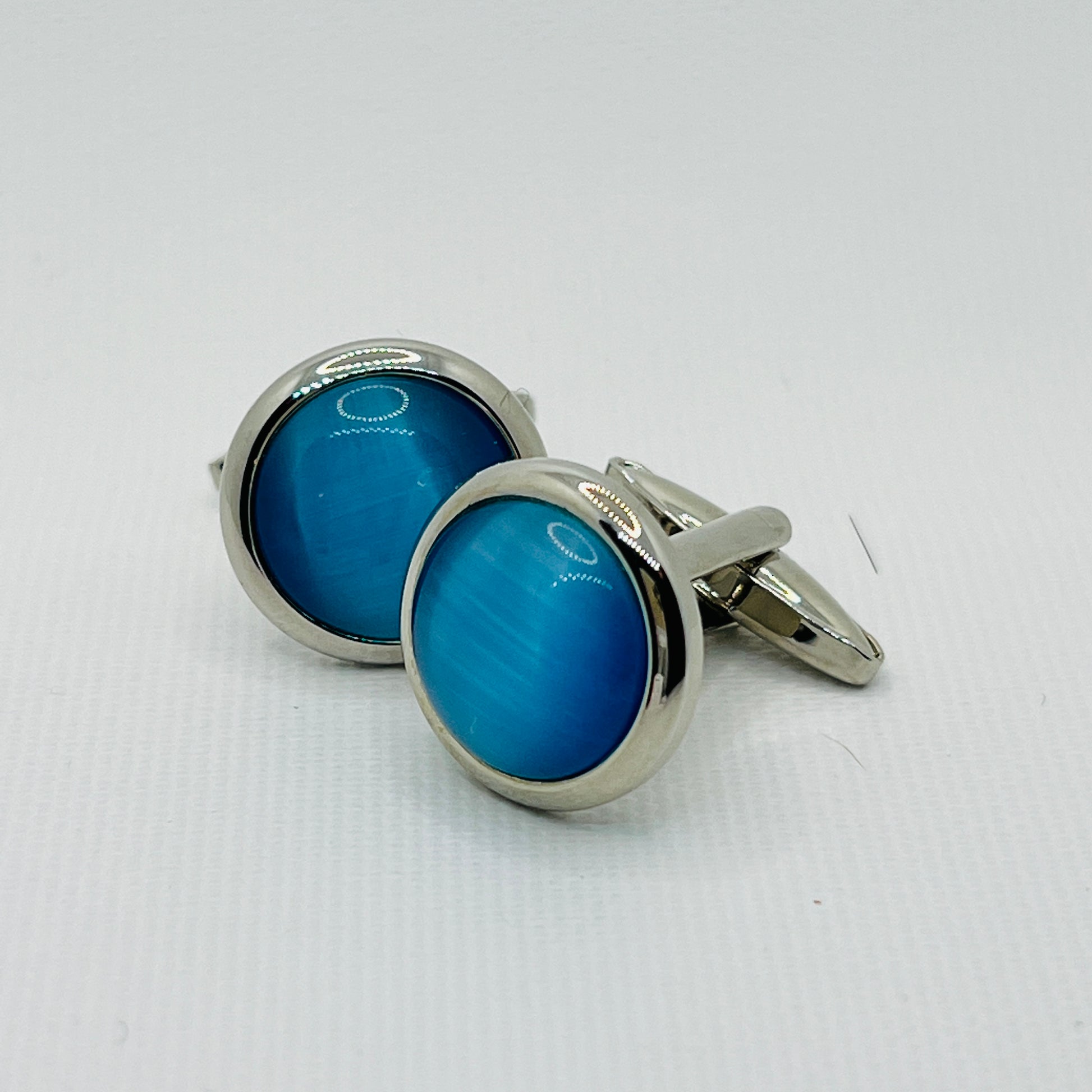 Tasker & Shaw | Luxury Menswear | Silver round cufflinks with smoked blue inlaid front