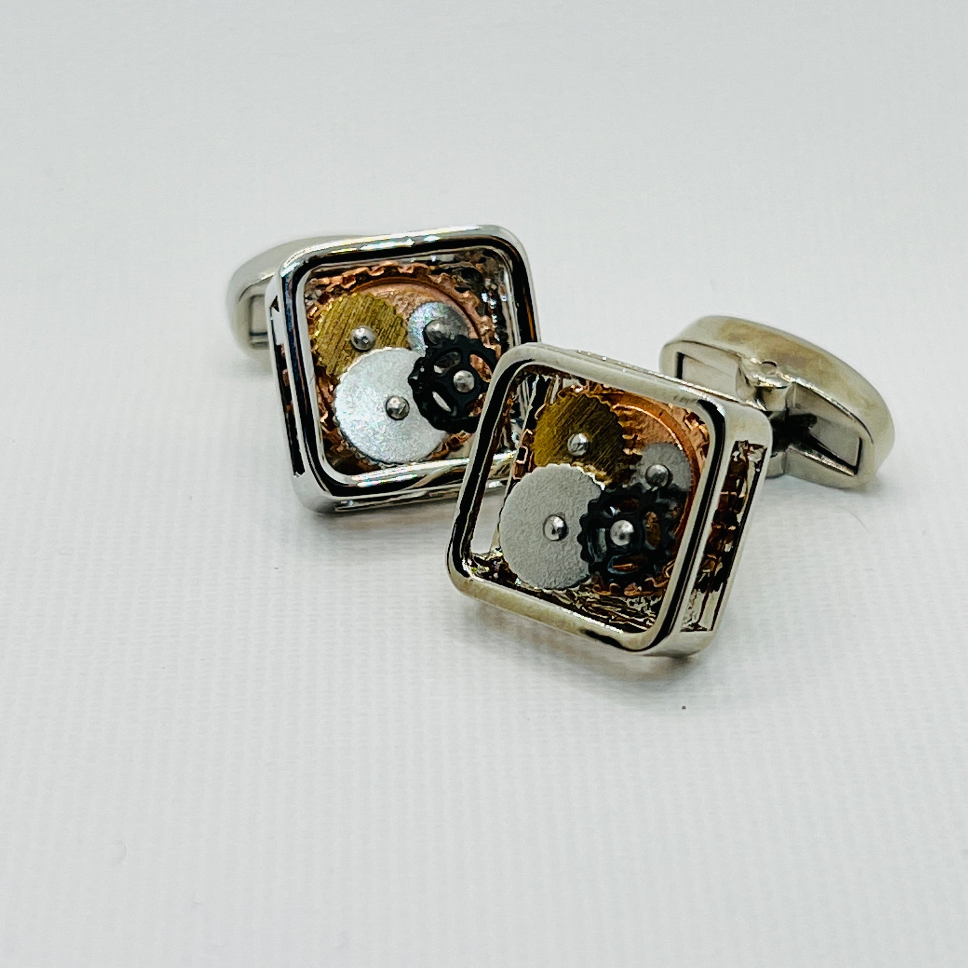 Tasker & Shaw | Luxury Menswear | Square skeleton cufflinks with watch mechanism