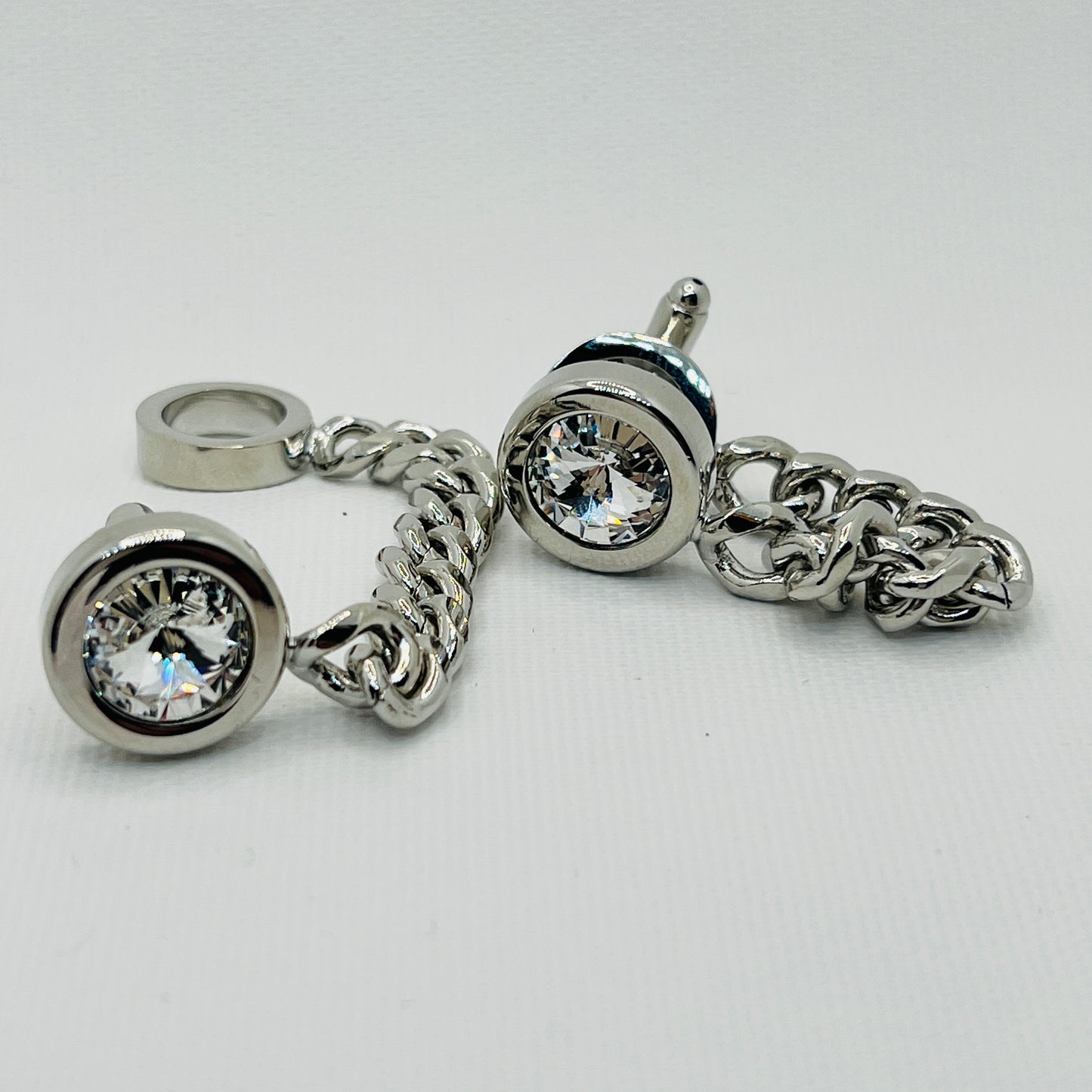 Tasker & Shaw | Luxury Menswear | Round silver cufflinks with crystal face and chain cuff protector