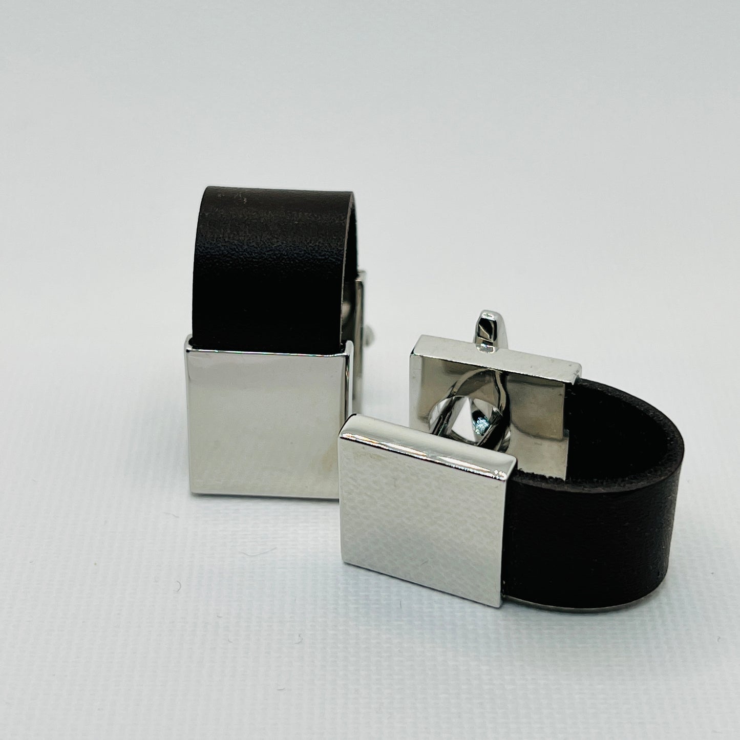 Tasker & Shaw | Luxury Menswear | Silver and leather cuff protector cufflinks